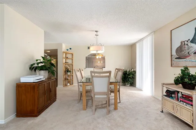 a kitchen with cabinets and wooden floor