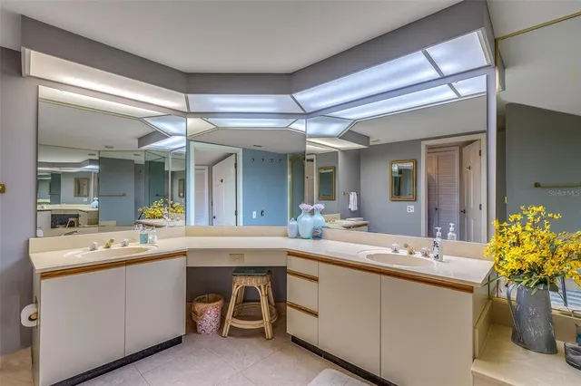 a bedroom with a bed and a view of bathroom