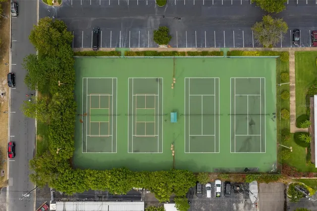 a view of a kitchen with dining area and chandelier