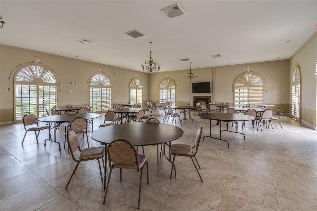 6500 Sunset Way, Unit 116 St. Pete Beach, FL 33706 - Photo 44 of 56 a view of a a dining room with furniture window and wooden floor