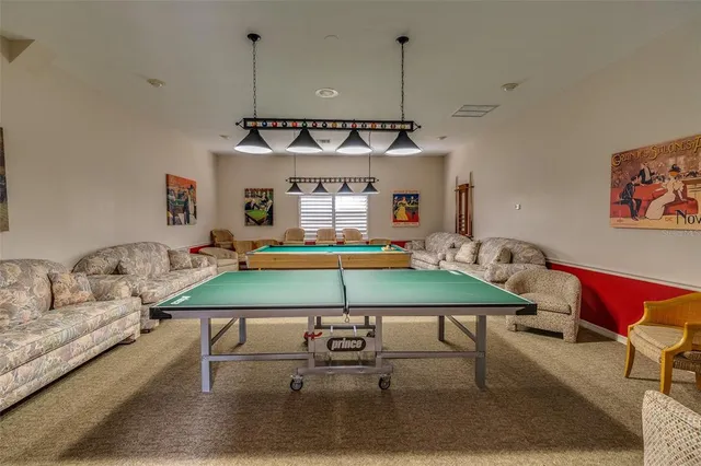 a view of a fountain in front of a brick house