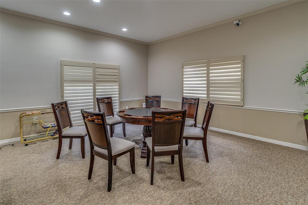6500 Sunset Way, Unit 116 St. Pete Beach, FL 33706 - Photo 52 of 56 a view of a dining room with furniture