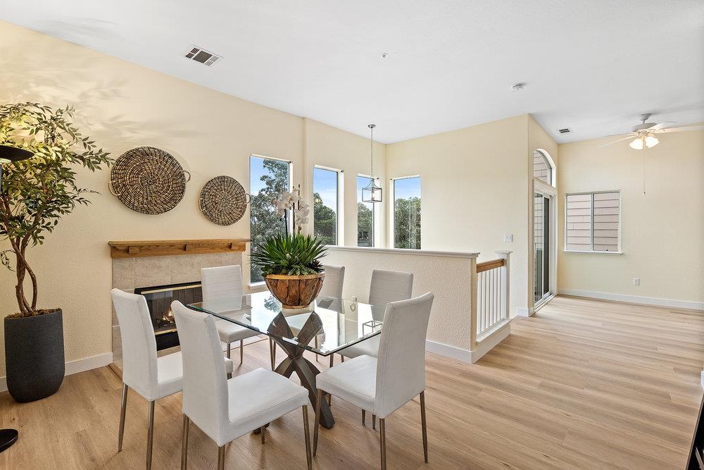586 Alexis Circle Daly City, CA 94014 - Photo 13 of 61 a view of a dining room with furniture and a fireplace