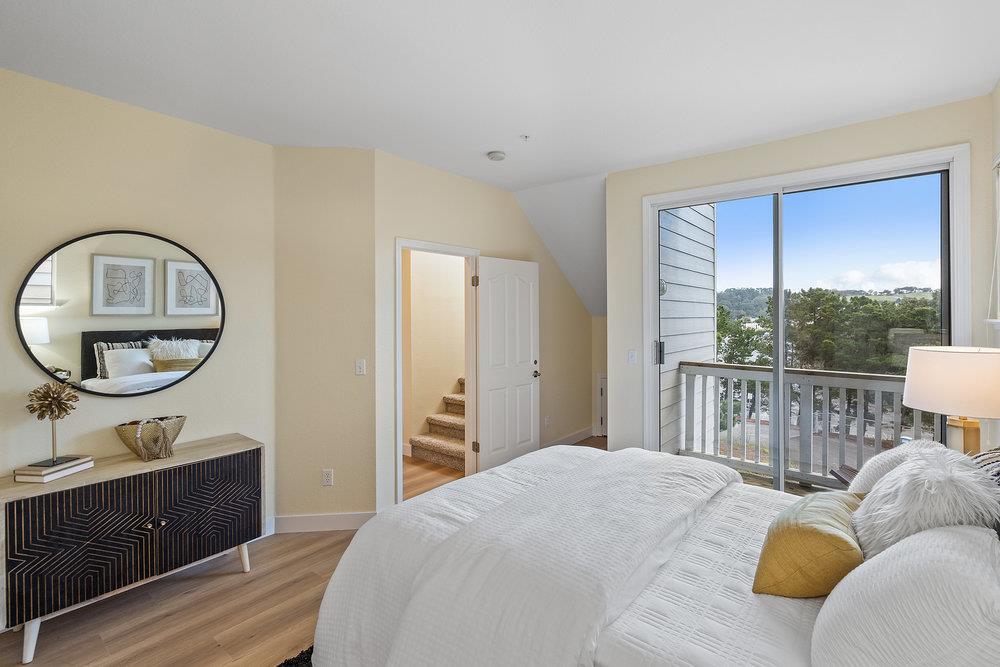 586 Alexis Circle Daly City, CA 94014 - Photo 21 of 61 a bedroom with a bed a mirror on dresser and a large window