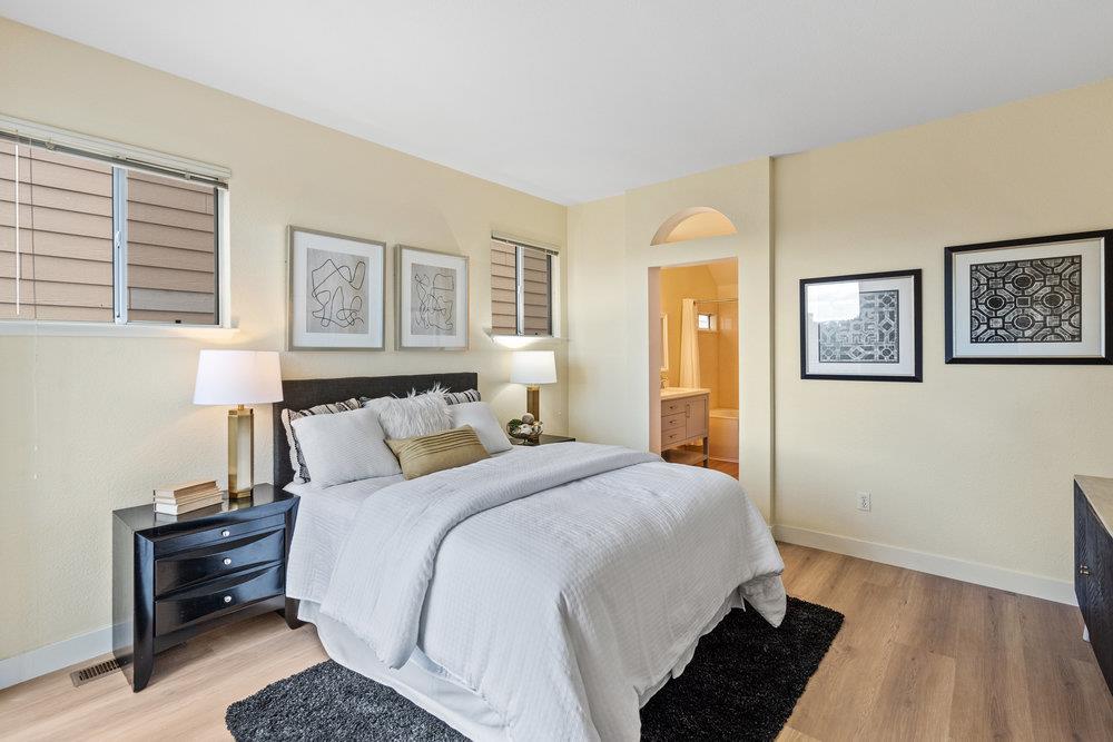 586 Alexis Circle Daly City, CA 94014 - Photo 22 of 61 a bedroom with a bed and wooden floor
