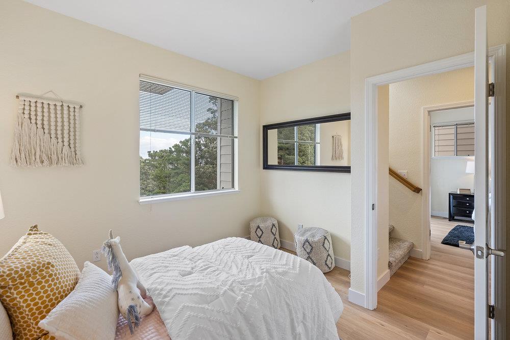 586 Alexis Circle Daly City, CA 94014 - Photo 24 of 61 a bedroom with a bed and wooden floor