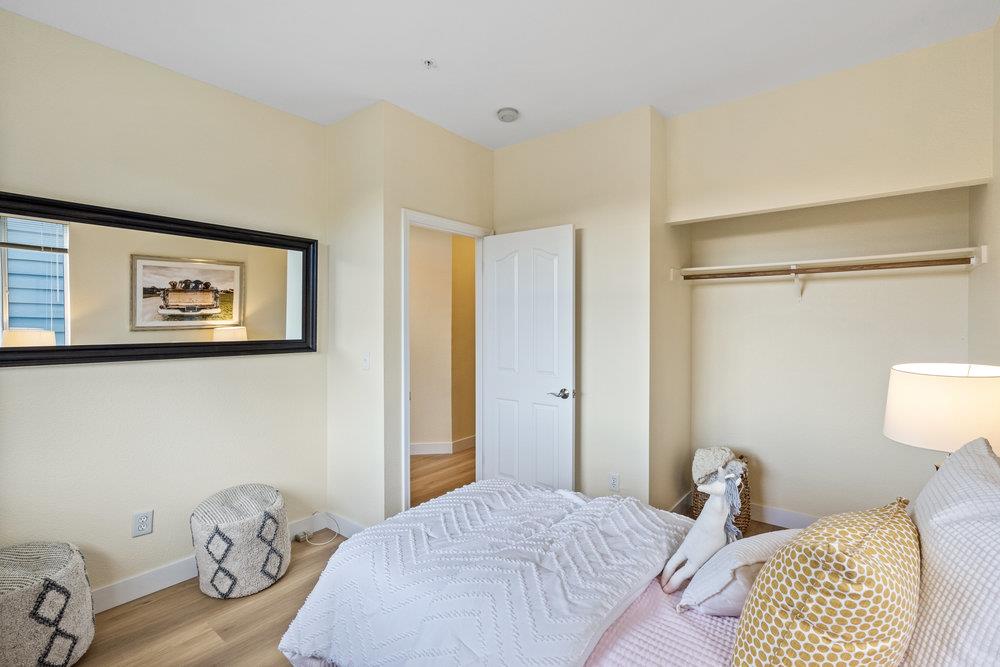 586 Alexis Circle Daly City, CA 94014 - Photo 27 of 61 a bedroom with a bed and a lamp on the dresser