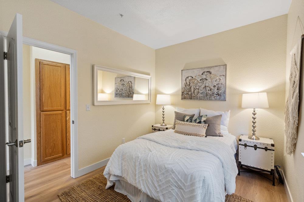 586 Alexis Circle Daly City, CA 94014 - Photo 30 of 61 a bedroom with a bed and wooden floor