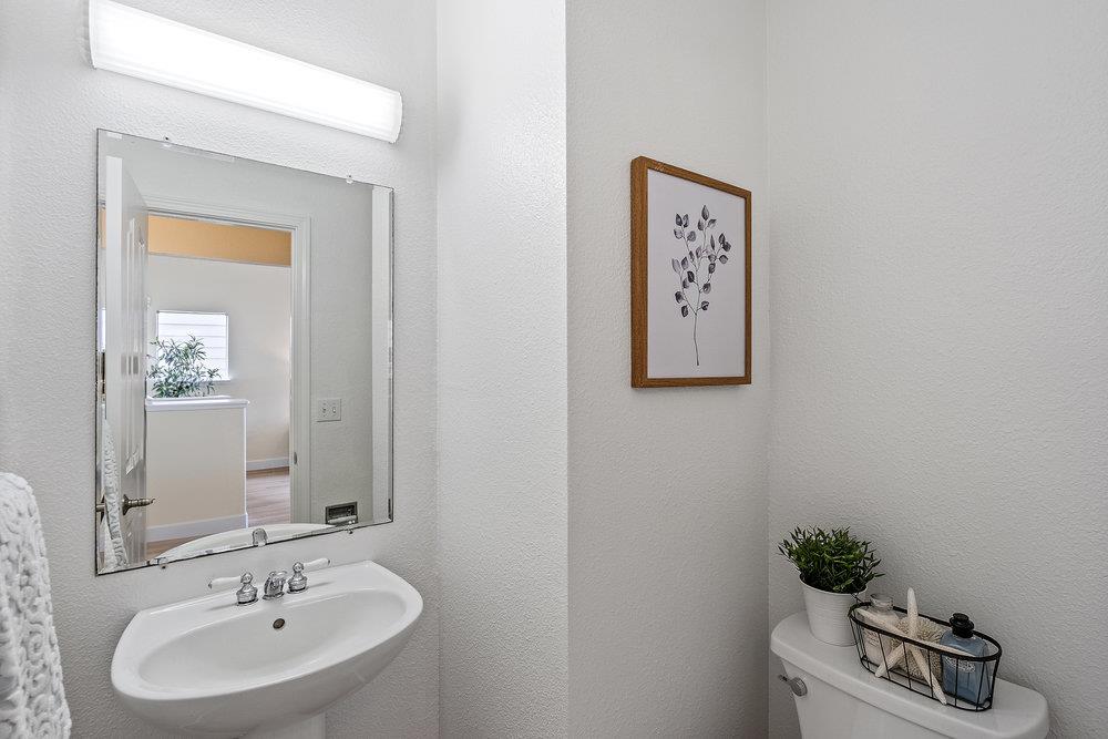 586 Alexis Circle Daly City, CA 94014 - Photo 34 of 61 a bathroom with a sink and a mirror