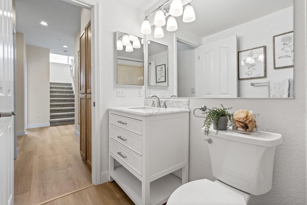 586 Alexis Circle Daly City, CA 94014 - Photo 35 of 61 a bathroom with a toilet sink and mirror