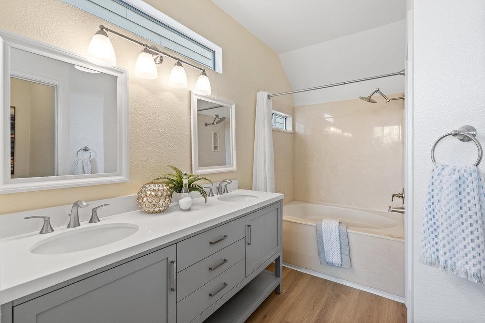 586 Alexis Circle Daly City, CA 94014 - Photo 37 of 61 a bathroom with a double vanity sink mirror double and shower