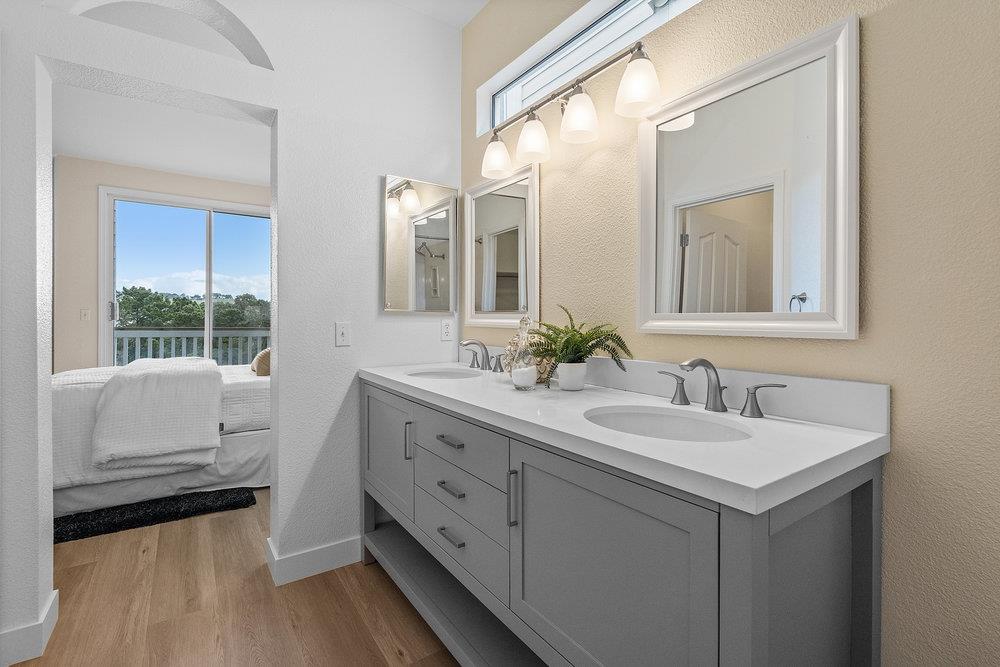 586 Alexis Circle Daly City, CA 94014 - Photo 38 of 61 a en suite bathroom with a double vanity sink and mirror