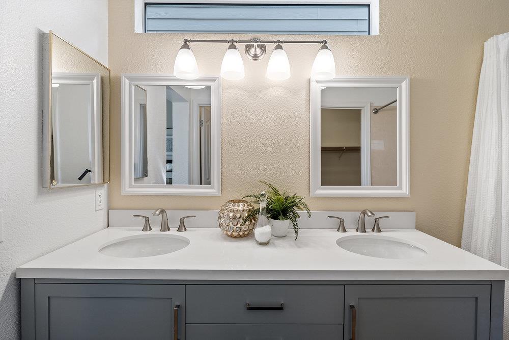 586 Alexis Circle Daly City, CA 94014 - Photo 41 of 61 a bathroom with a sink and a mirror