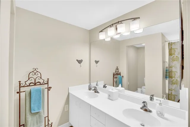 a bathroom with a shower curtain and a bathtub