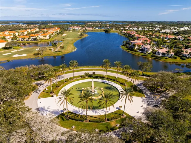an aerial view of a houses with swimming pool