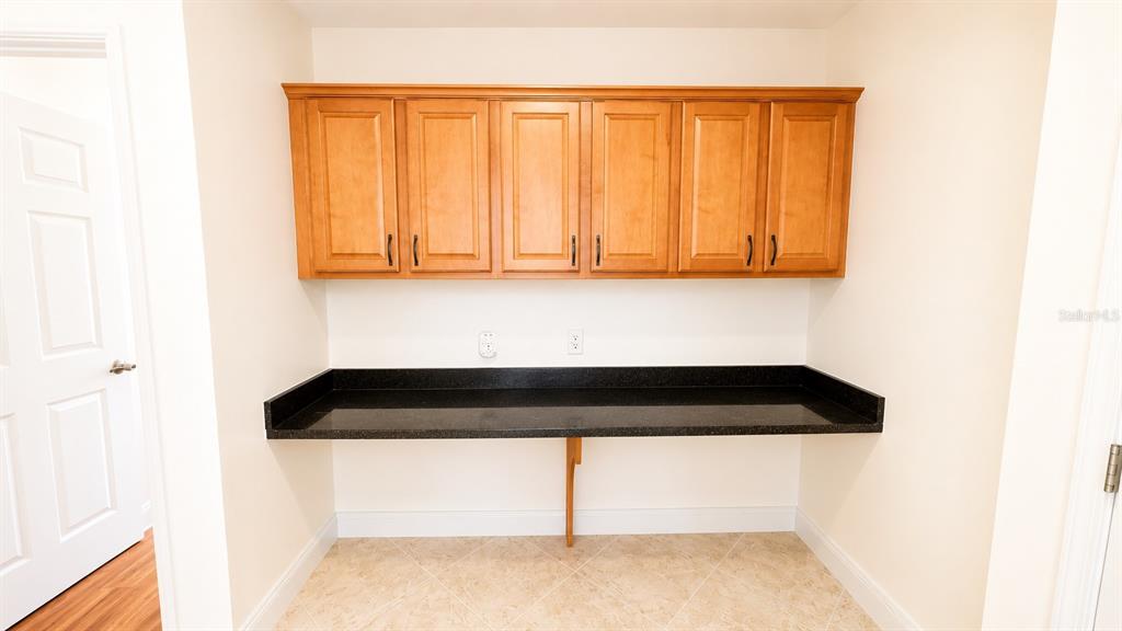 6552 Moorings Point Circle, Unit 102 Lakewood Ranch, FL 34202 - Photo 13 of 57 a close view of shoes stand in a room