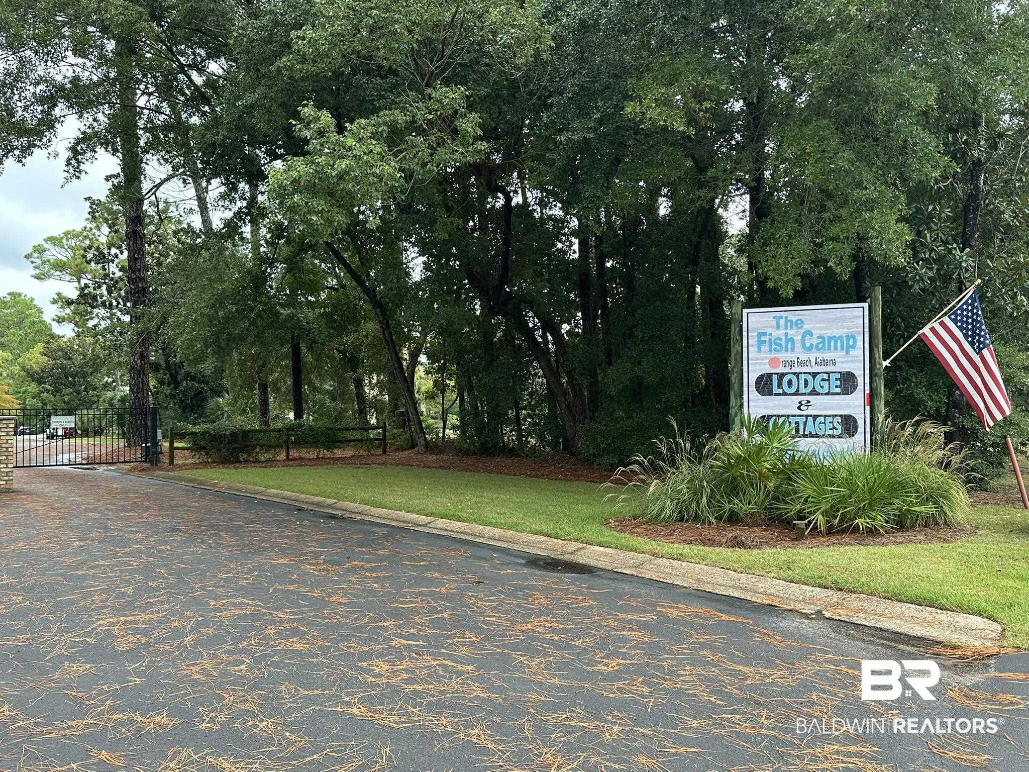 25773 Canal Road Orange Beach, AL 36561 - Photo 5 of 32 View of community featuring a lawn