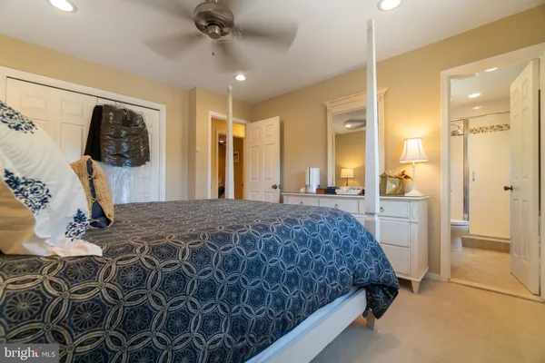 a bedroom with a bed and a walk in closet