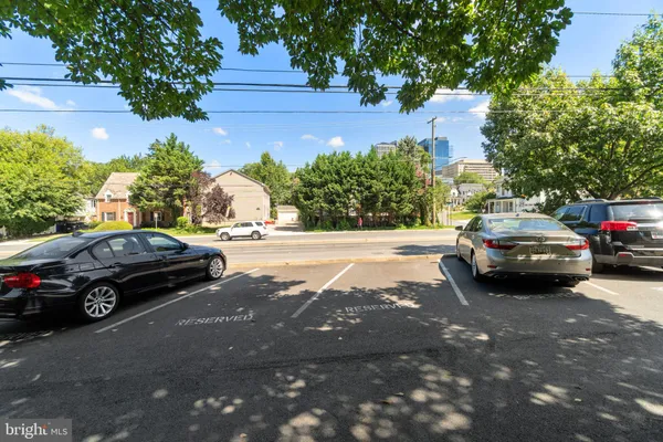 a view of street with parked cars