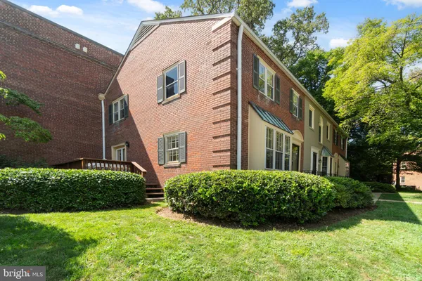 a view of a house with a yard and plants
