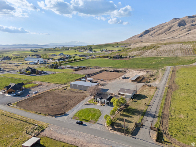115 East 1600th Street North Santaquin, UT 84655 - Photo 39 of 52 Sprawling property featuring a central residence, multiple accessory buildings, and expansive open land