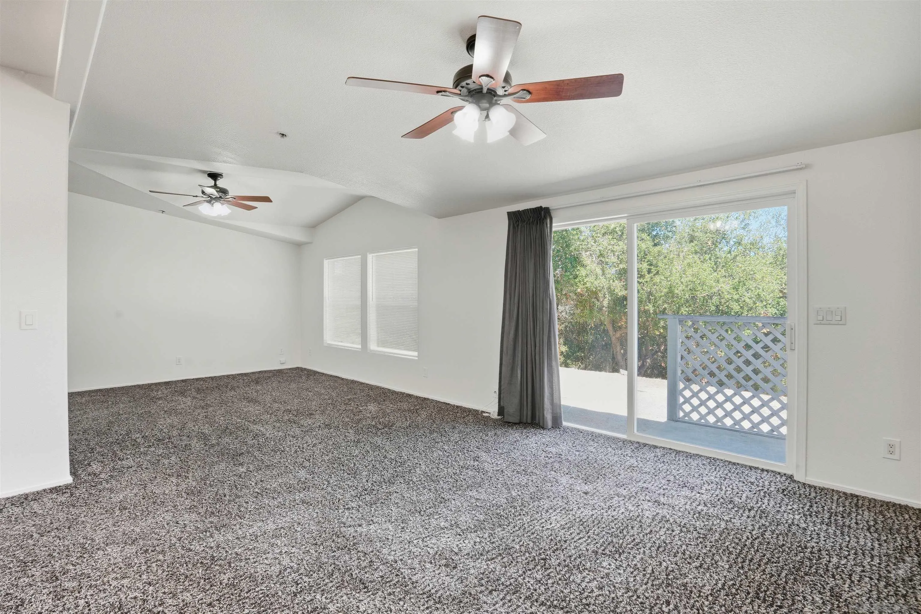 15453 Woods Valley Road Valley Center, CA 92082 - Photo 14 of 38 a view of an empty room with windows