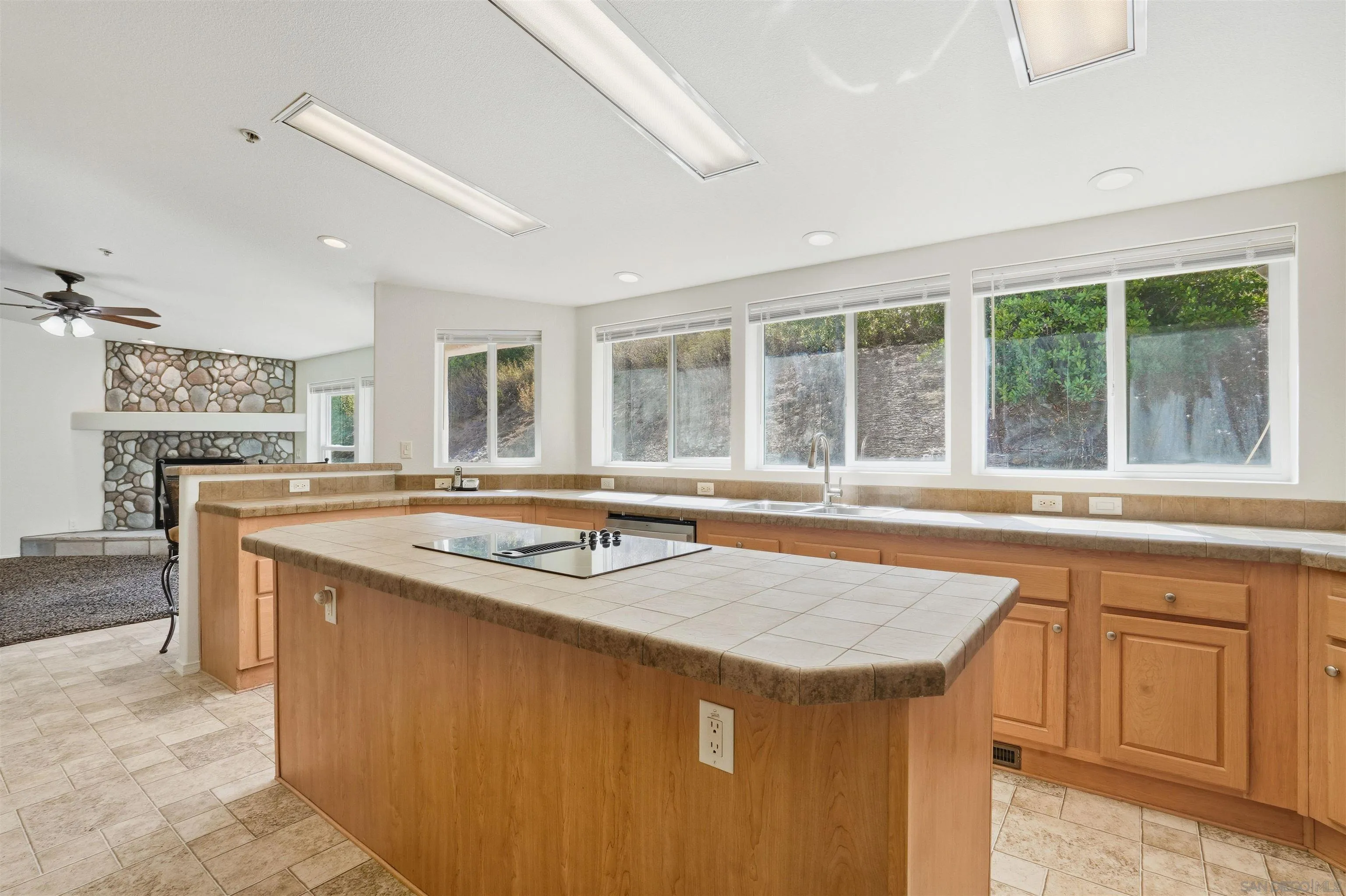 15453 Woods Valley Road Valley Center, CA 92082 - Photo 2 of 38 a kitchen with a stove and a sink