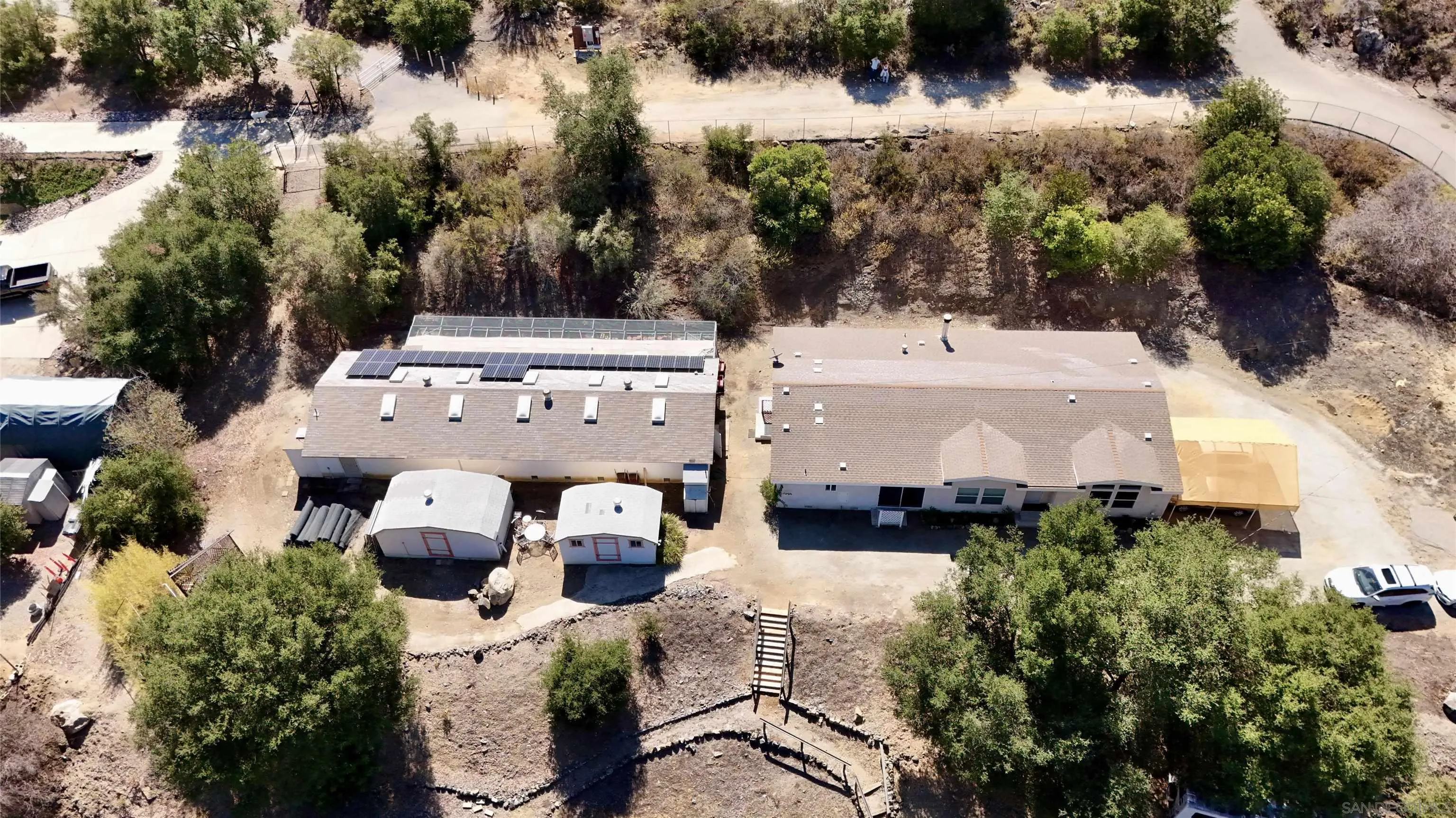 15453 Woods Valley Road Valley Center, CA 92082 - Photo 33 of 38 an aerial view of a house with yard and lake view