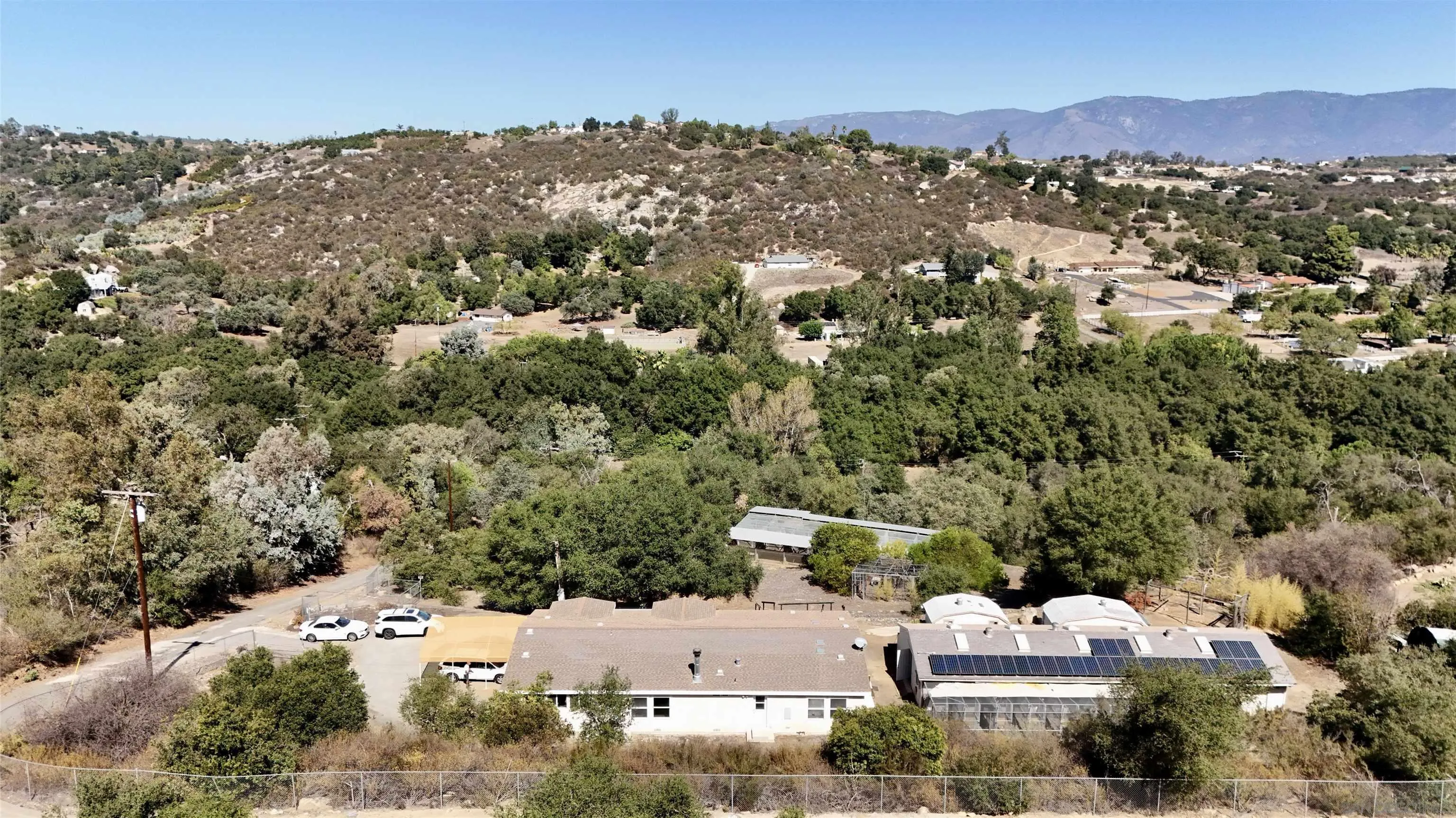 15453 Woods Valley Road Valley Center, CA 92082 - Photo 35 of 38 an aerial view of residential houses with outdoor space and trees