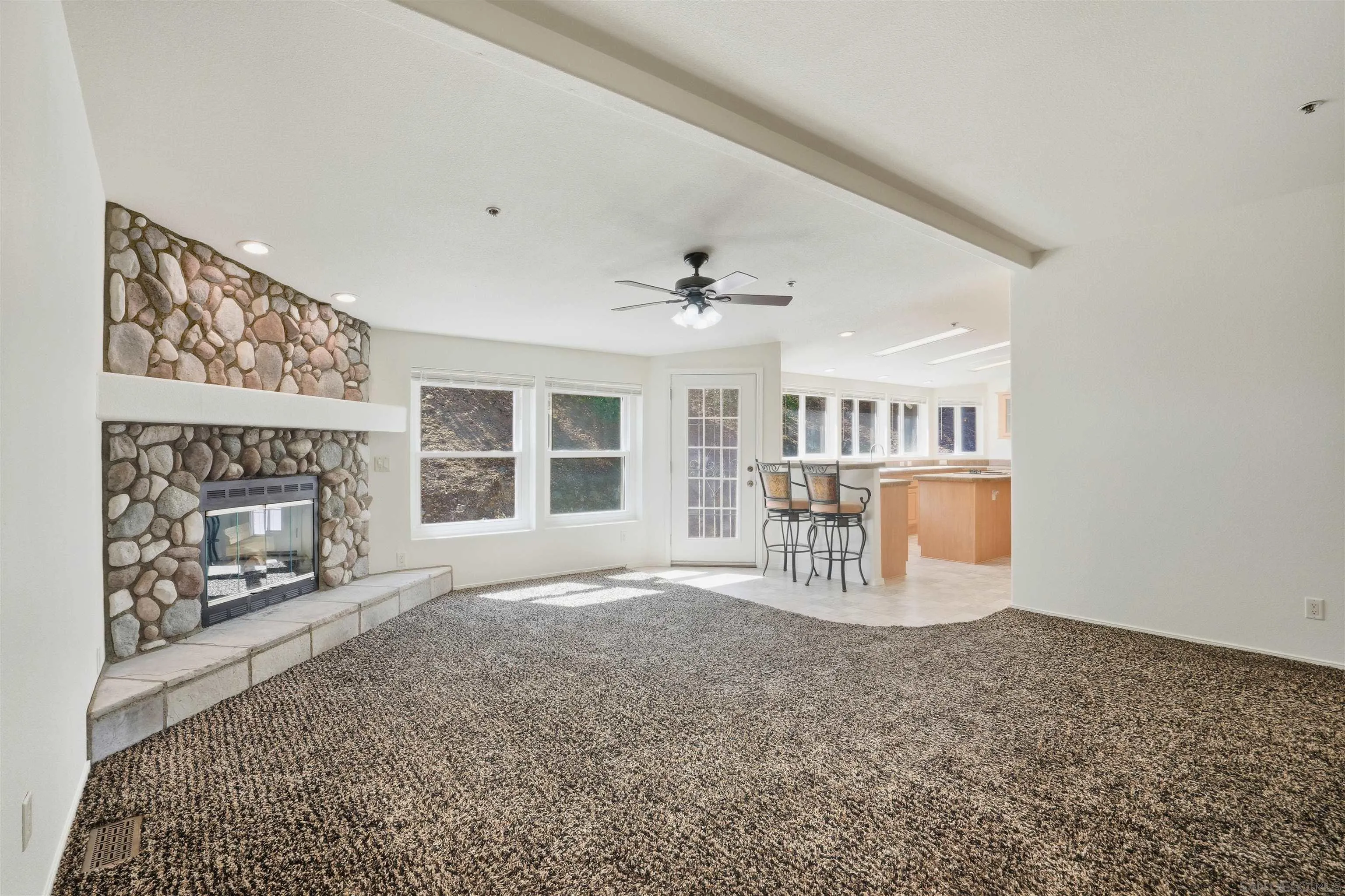 15453 Woods Valley Road Valley Center, CA 92082 - Photo 5 of 38 a view of an empty room with a fireplace