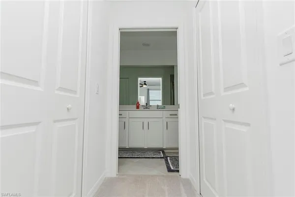 a bathroom with a shower sink and mirror