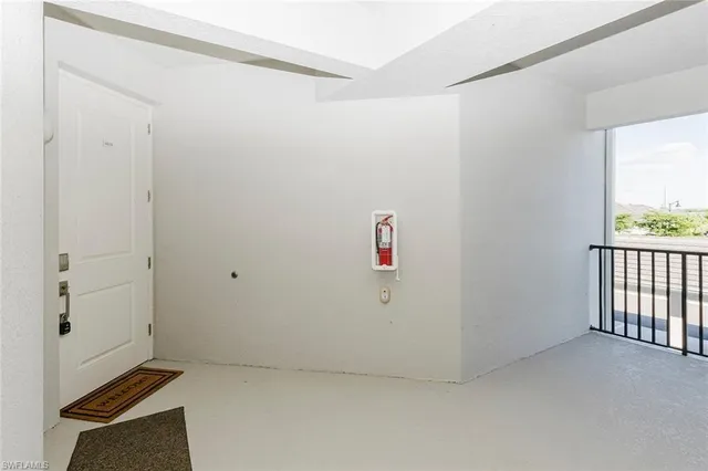 a front view of a house with plants