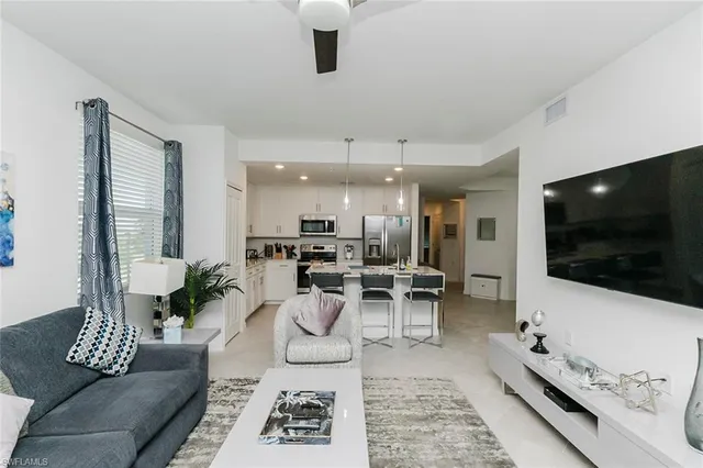 a living room with a couch and a large window