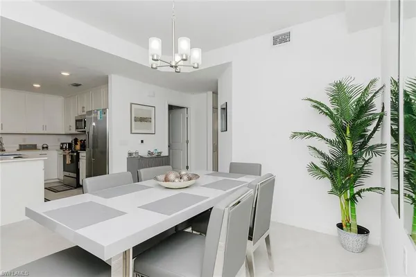 a kitchen with stainless steel appliances a sink stove and refrigerator