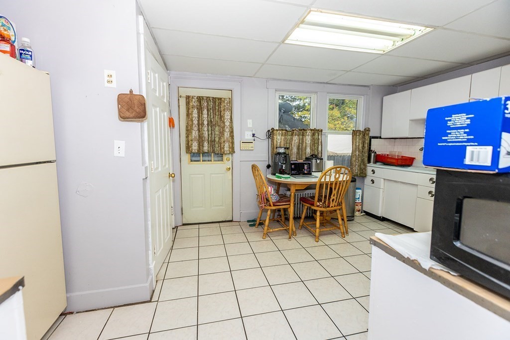 37 Alberta Street Springfield, MA 01108 - Photo 8 of 21 a room with furniture a flat screen tv and a table