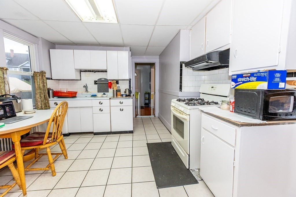 37 Alberta Street Springfield, MA 01108 - Photo 9 of 21 a kitchen with a sink a stove cabinets and counter space