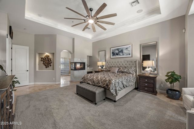 a view of a livingroom with furniture and a hallway