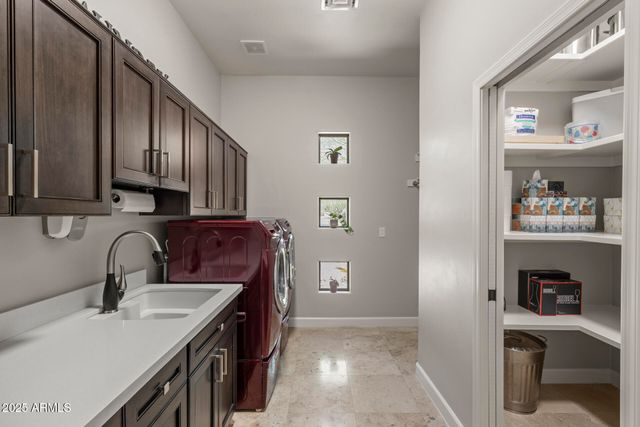 a view of a chairs and table in patio