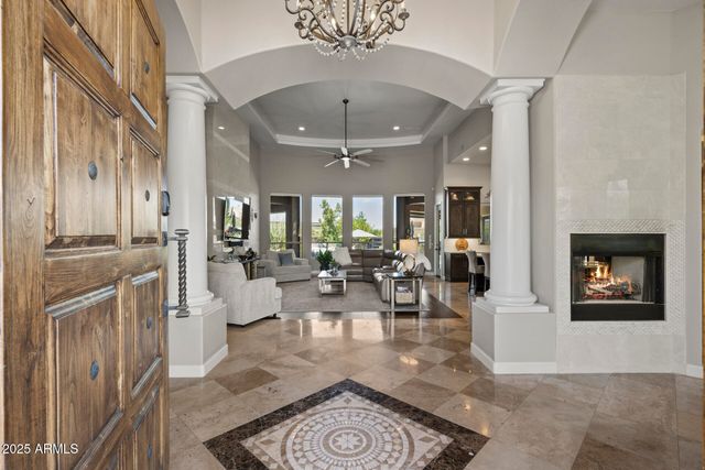 a view of hall way with furniture