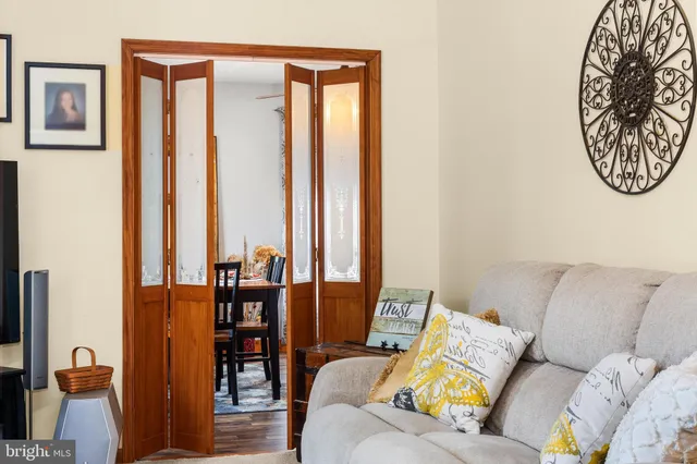a living room with furniture and large windows