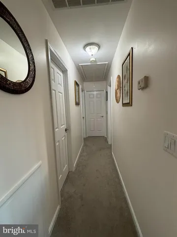 a view of a hallway and a mirror