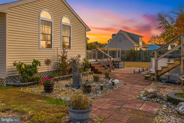 a front view of a house with sitting area