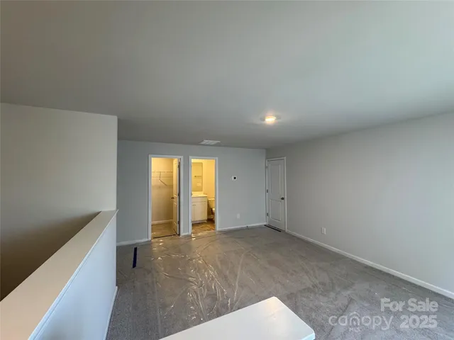 a view of an empty room and a window