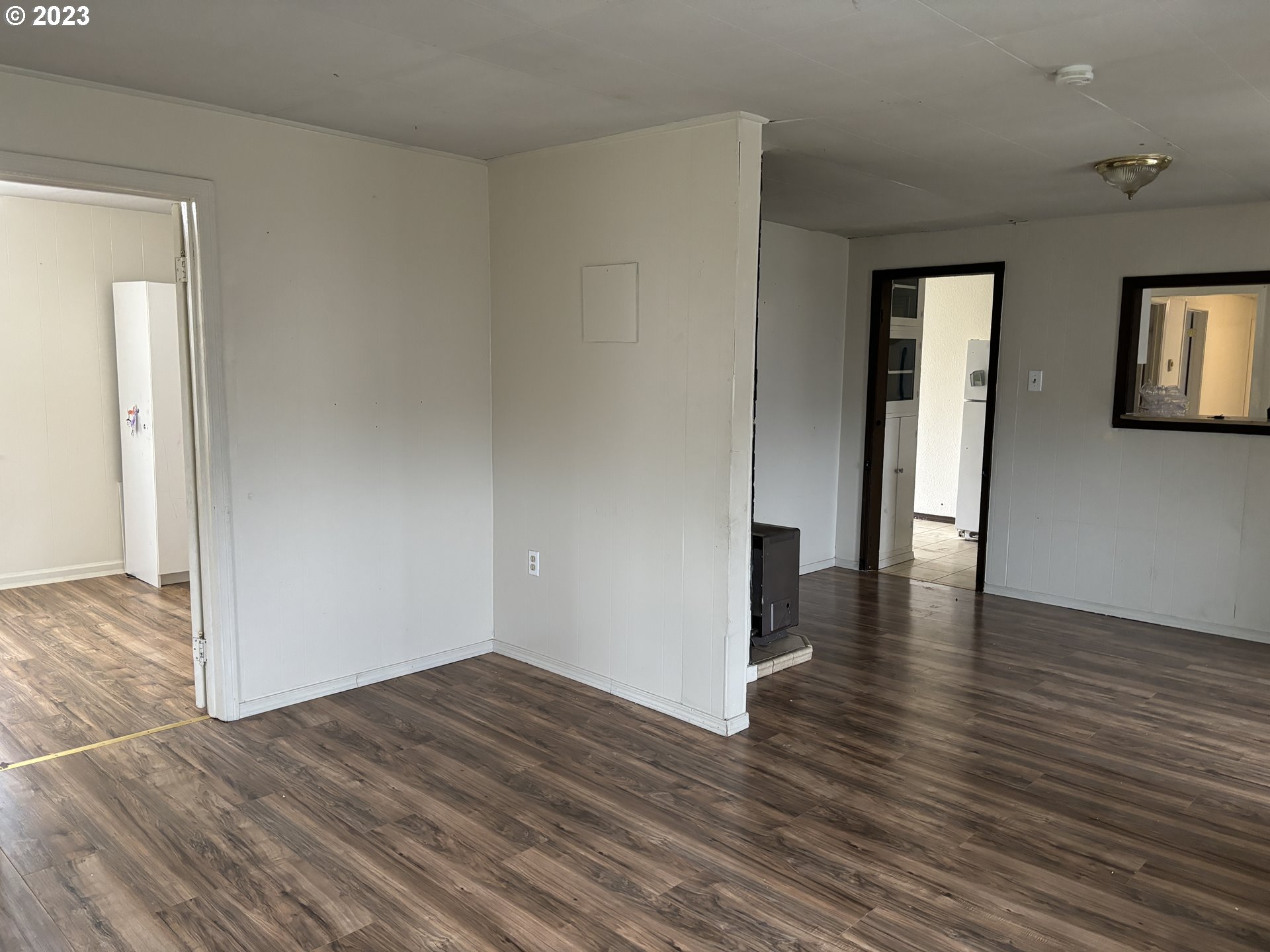 707 Southwest 15th Street Pendleton, OR 97801 - Photo 3 of 20 a view of a hallway with wooden floor