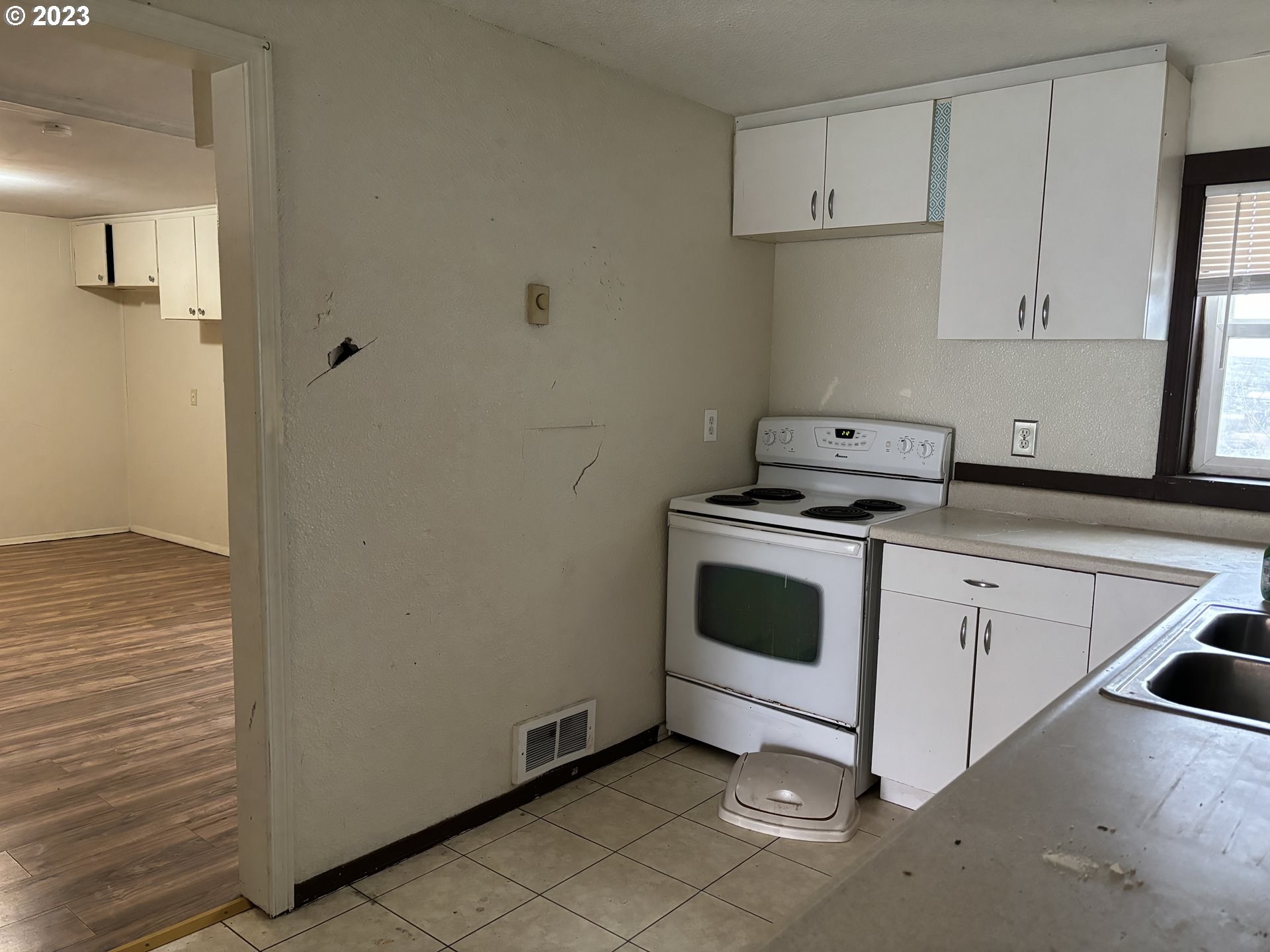 707 Southwest 15th Street Pendleton, OR 97801 - Photo 9 of 20 a white stove top oven sitting inside of a kitchen