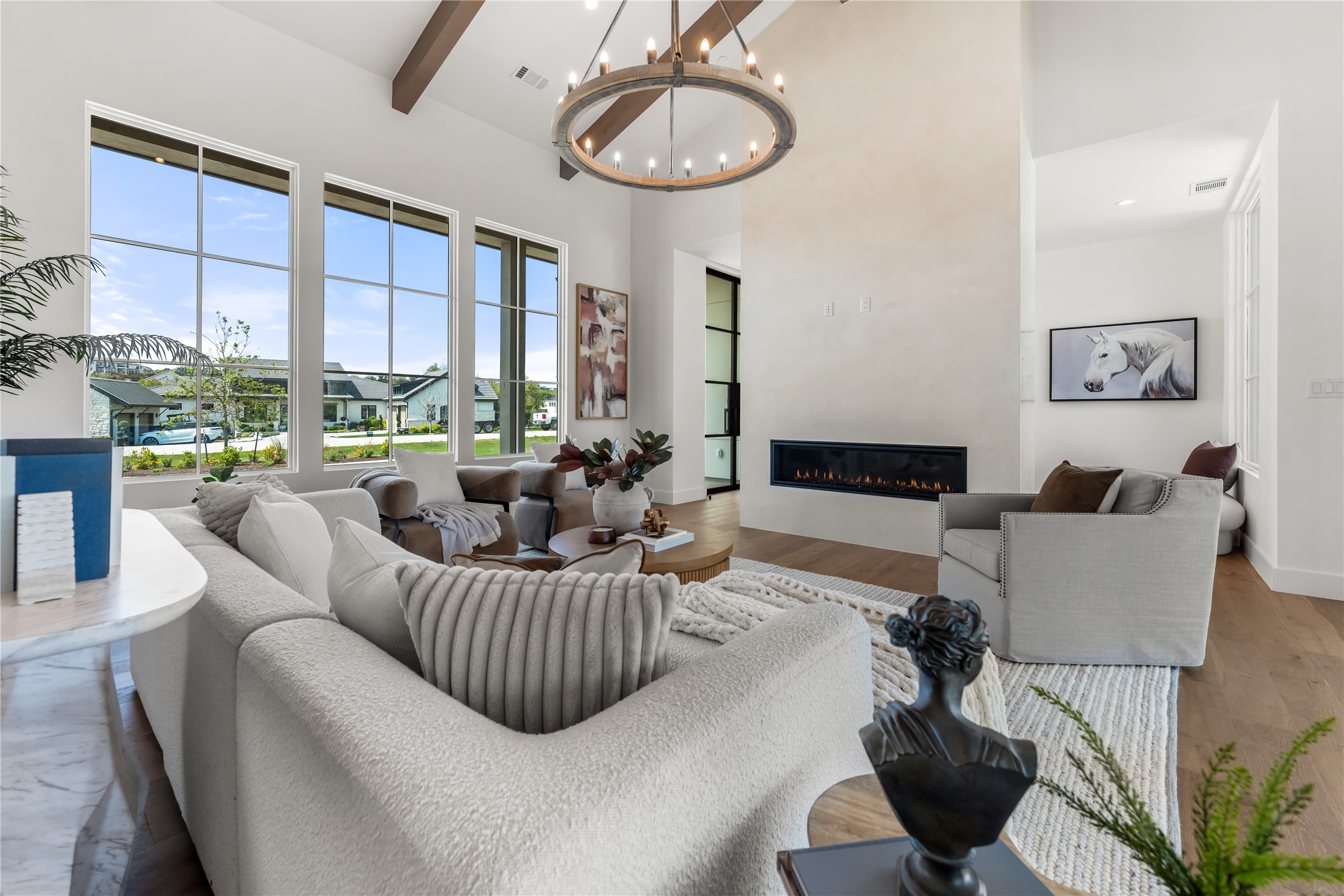 17212 Morning Grove Lane Austin, TX 78738 - Photo 7 of 38 a living room with furniture and a large window