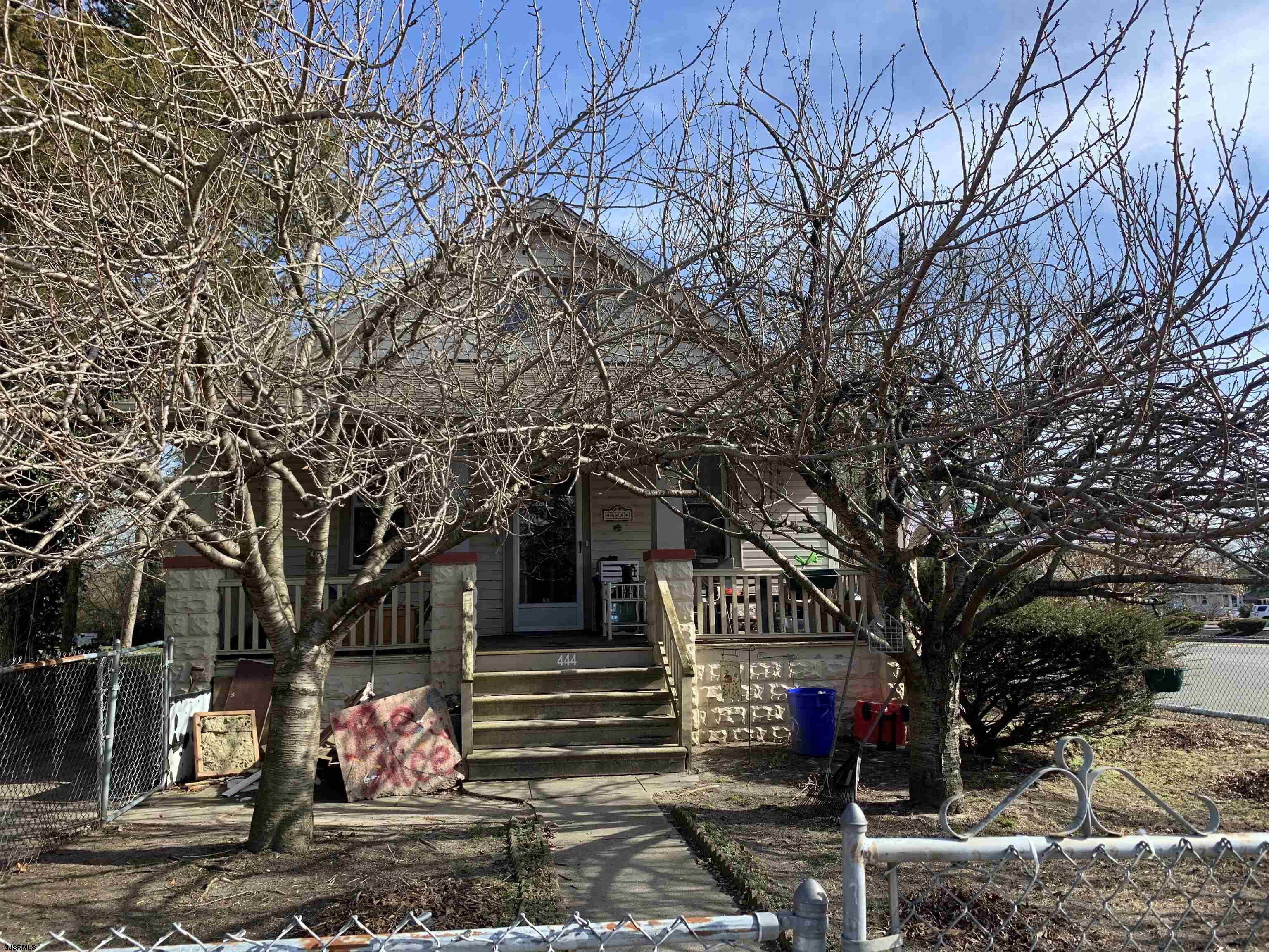 444 Shore Road Somers Point, NJ 08244 - Photo 5 of 15 a front view of a building with trees