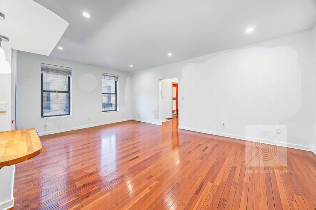 807 Riverside Drive, Unit 3A Manhattan, NY 10032 - Photo 3 of 8 a view of empty room with wooden floor and fan