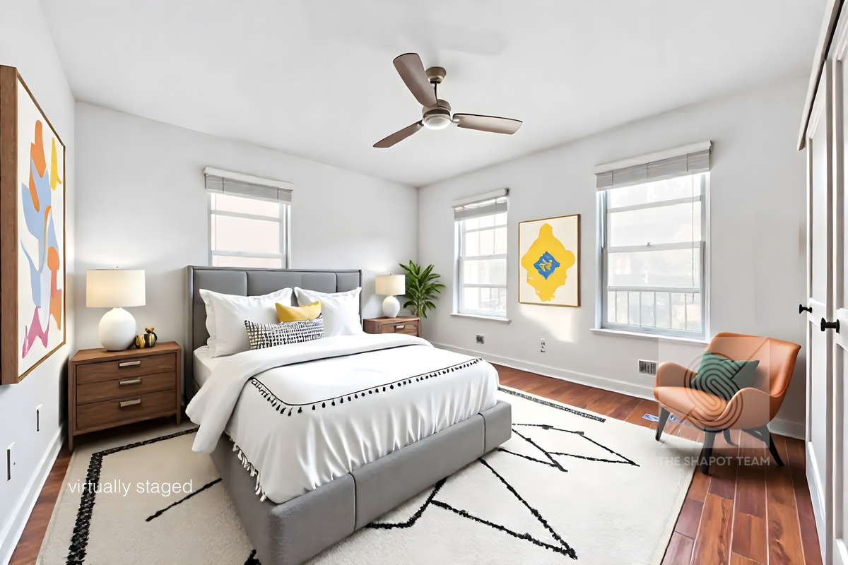 807 Riverside Drive, Unit 3A Manhattan, NY 10032 - Photo 6 of 8 a bedroom with a bed and wooden floor