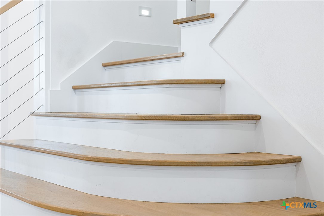 477 Willow Moon Ranch Road Crawford, TX 76638 - Photo 14 of 40 a view of staircase
